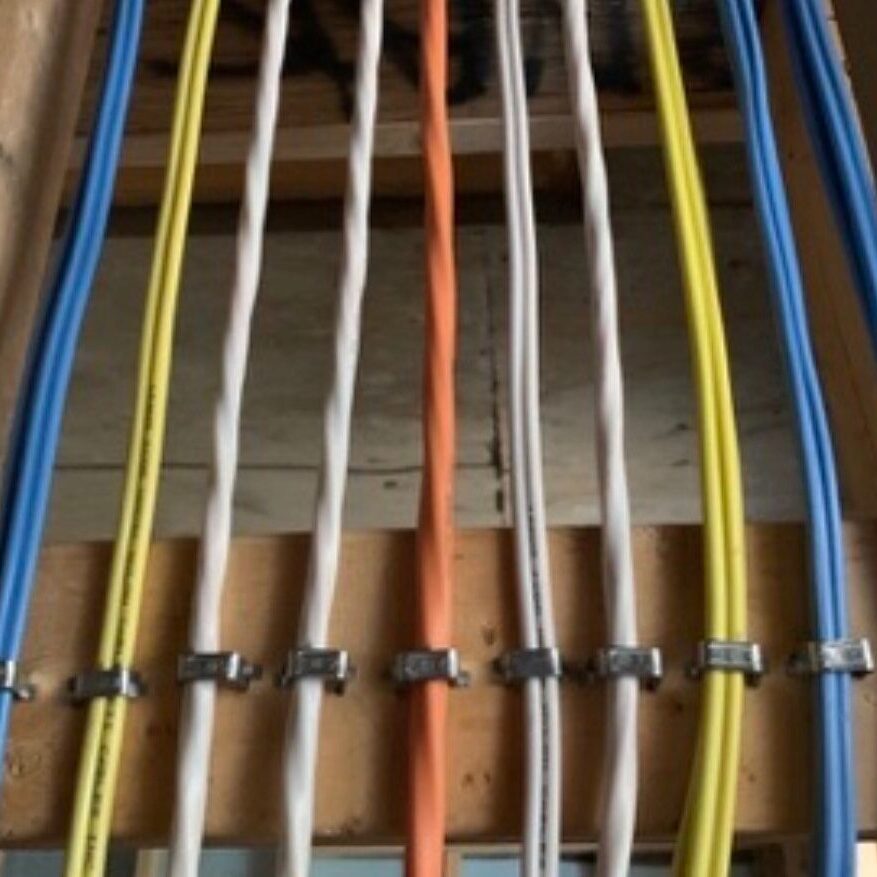 Electrician installing and upgrading an electrical panel